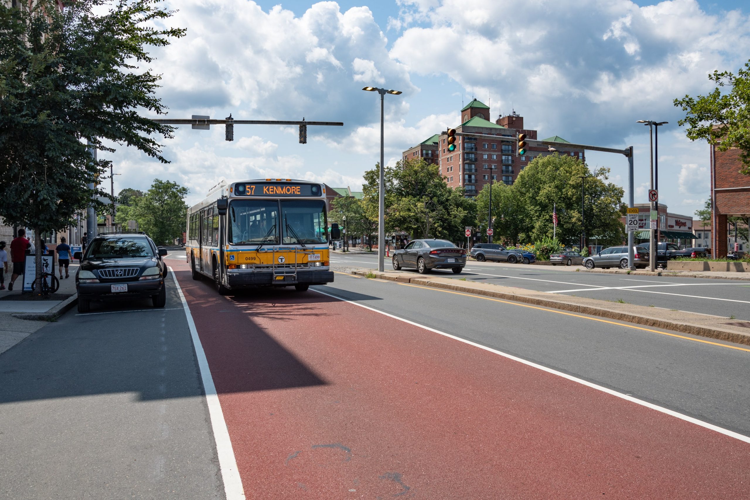 A number 57 bus in a dedicated bus lane in Allston